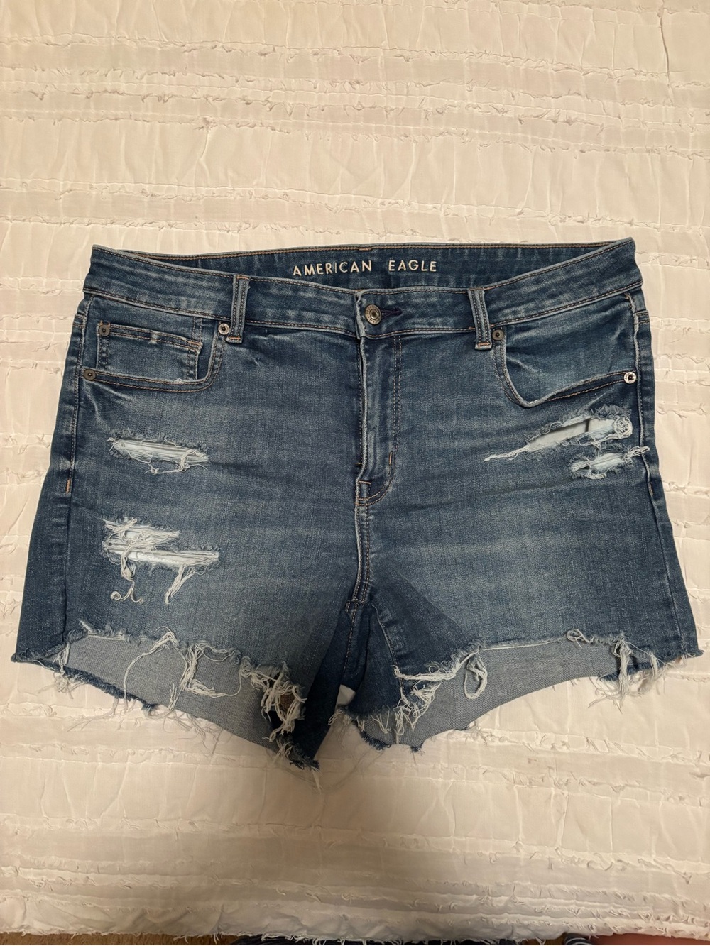 “AE next level ripped low-rise denim midi short”